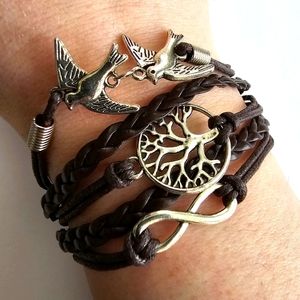 Bracelet with Peace sign, infinity symbol, and tree charms brown silver tone